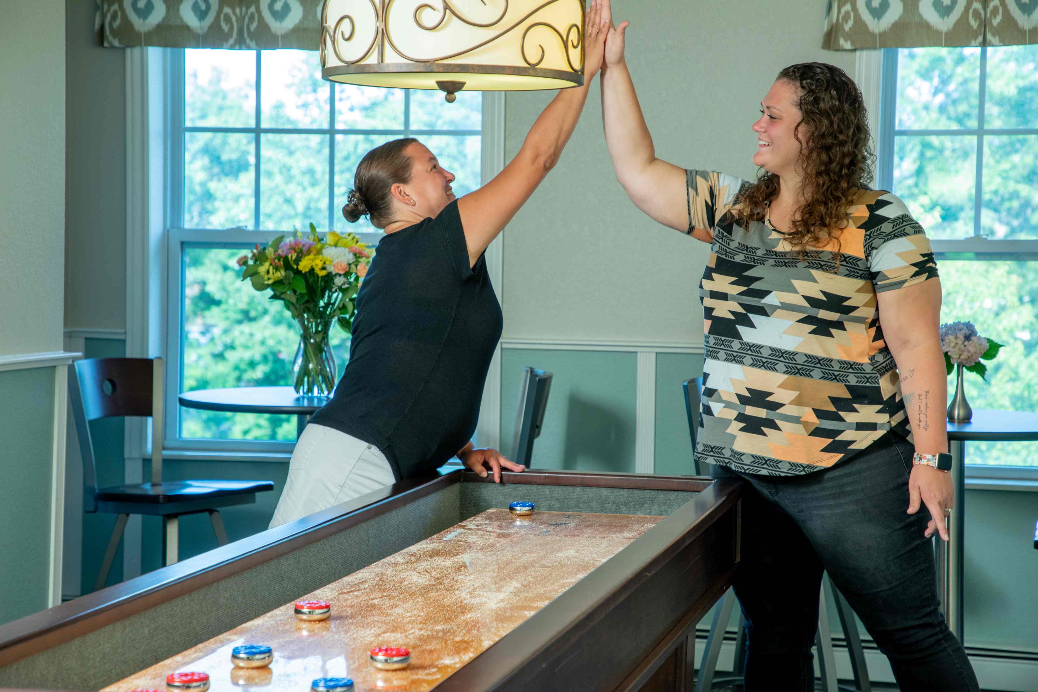 team members in game room