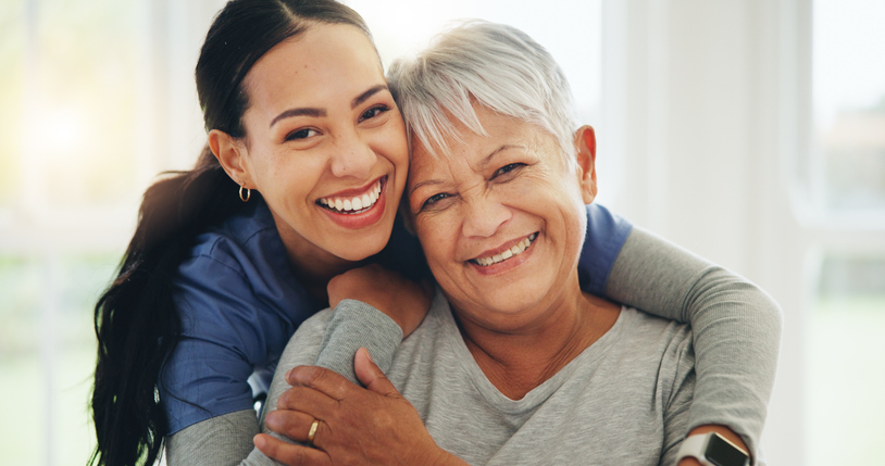 caregiver hugging woman